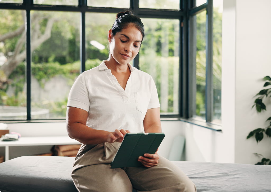 Physical therapist reviewing documentation