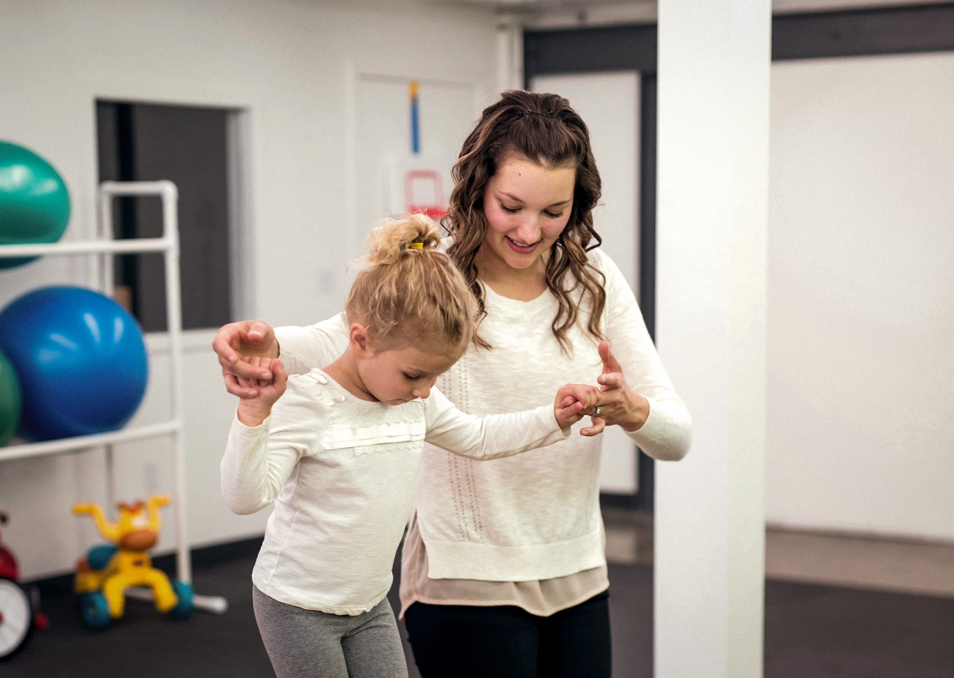Occupational therapist working with a child patient