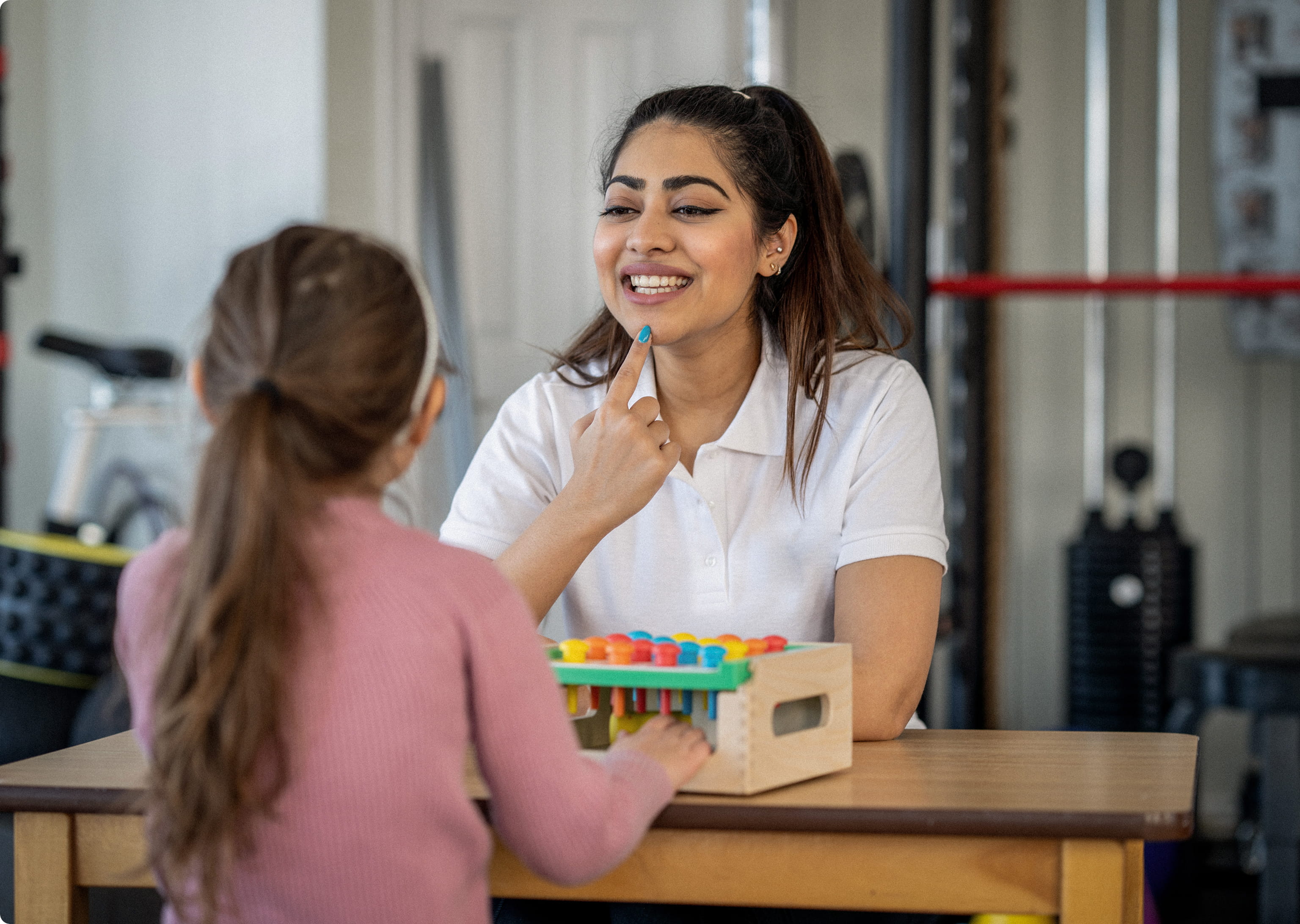 Speech language pathologist working with a patient