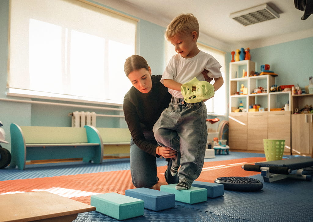 Occupational therapist working with a child patient