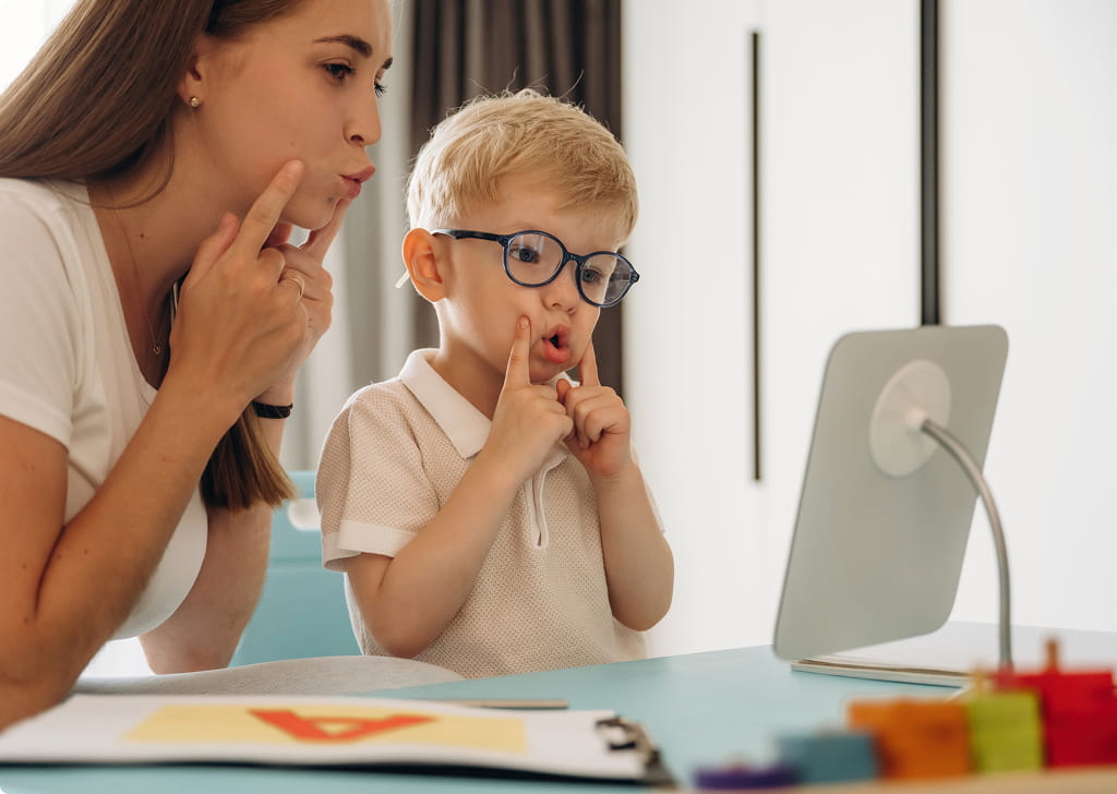 Speech language pathologist working with a child